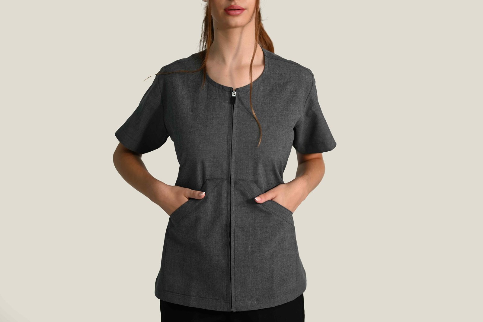 Detail view of V-neck short-sleeve healthcare uniform top, professional medical workwear.