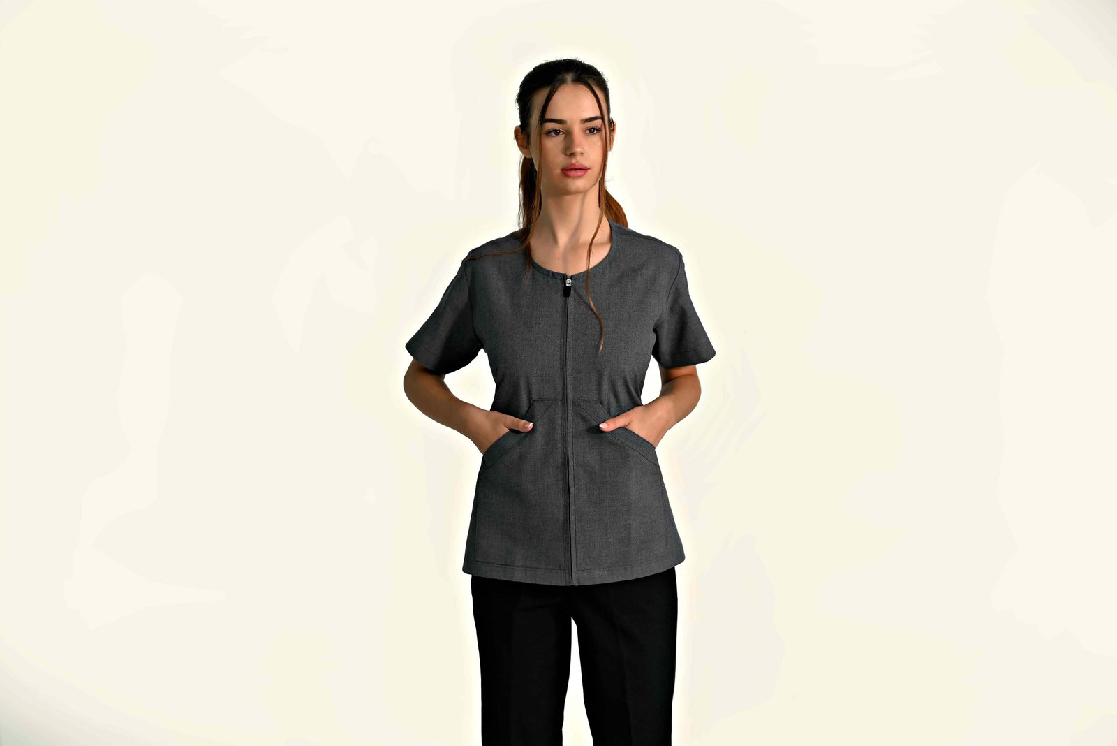 Healthcare uniform top with V-neck and short sleeves for clinical and care staff.